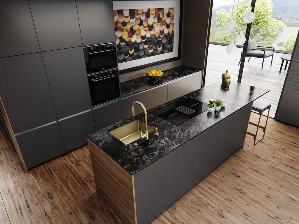 Franke Mythos Masterpiece kitchen — island with gold sink and tap, marble worktop.
