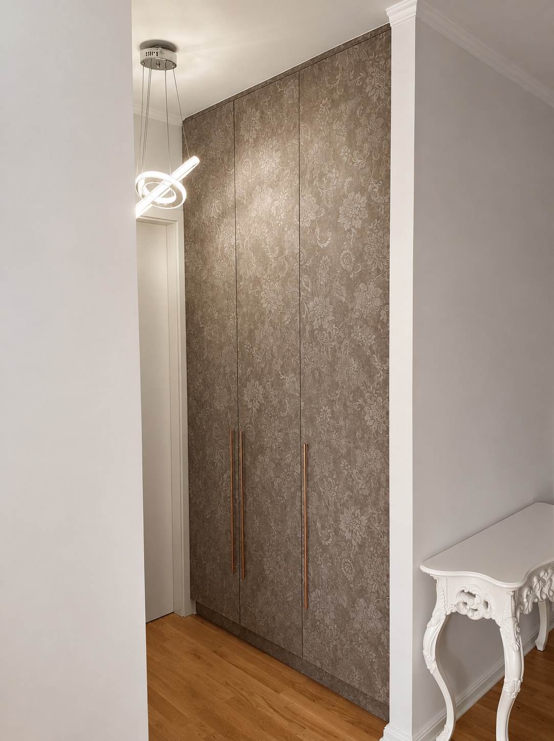 Febal Casa Momenti wardrobe with a textured floral decor and bronze handles