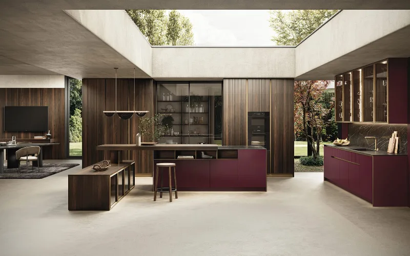 GF Interiors FLAT Crimson Lake island in walnut, with burgundy composition in the background and ceiling skylight